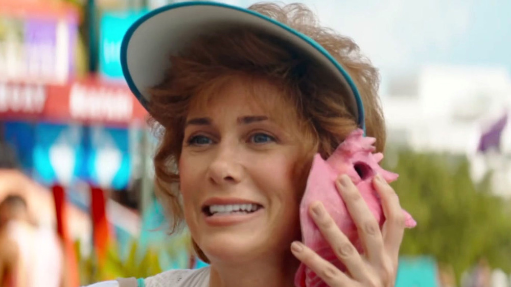 Kristen Wiig listens to shell