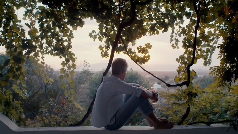 Anthony Bourdain sitting on balcony