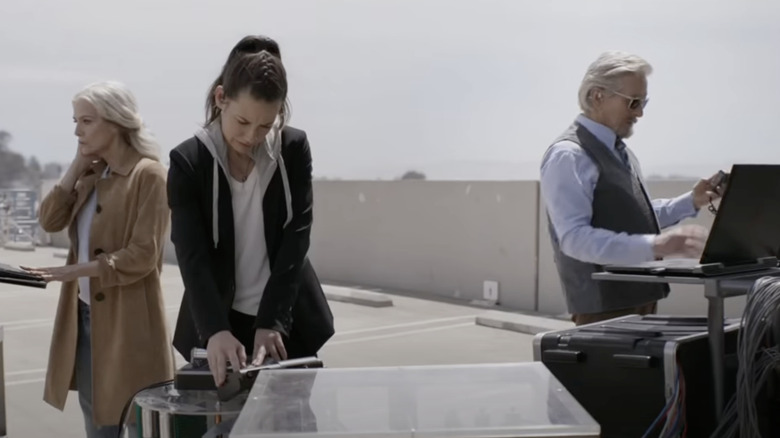 Janet, Hope, and Hank running equipment to send Scott safely into the Quantum Realm