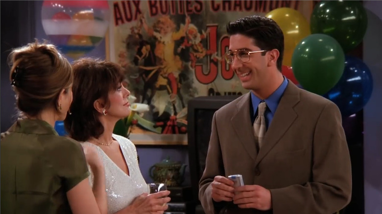 Ross wearing glasses and smiling