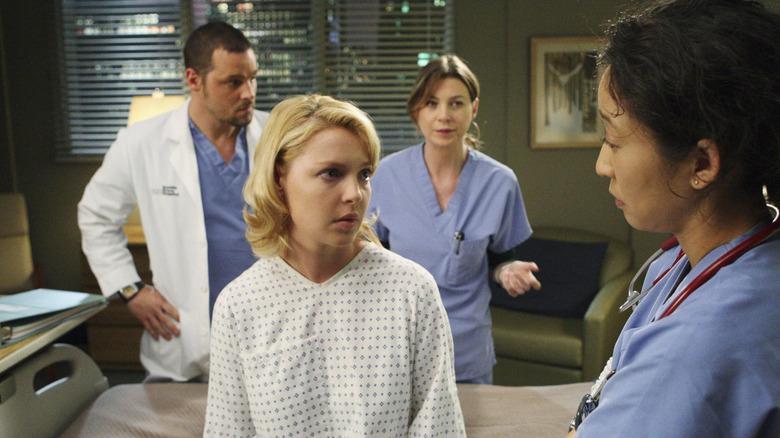 Doctors surrounding a patient
