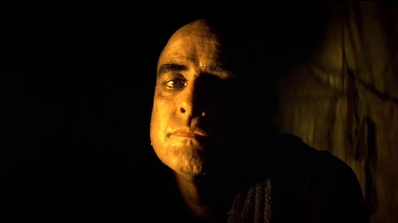 Colonel Kurtz in Apocalypse Now Colonel Kurtz's face reveal is still regarded as one of the great images of cinema. In the movie, Kurtz had lost his mind and started his own war. He was constantly mentioned but never seen until the last act when we see him emerge from the darkness after talking to Martin Sheen's character. The audience immediately recognized Marlon Brando's voice, but it was still surprising to many to see him!