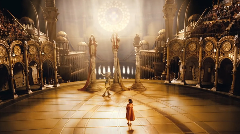 Ofelia stands in the throne room in Pan's Labyrinth
