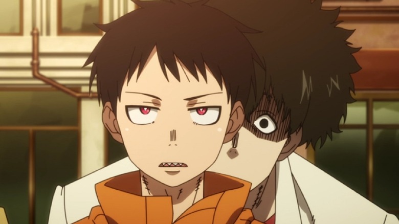 A young boy with red eyes in Fire Force