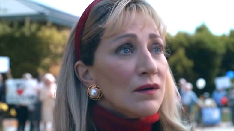 Edie Falco wearing red headband