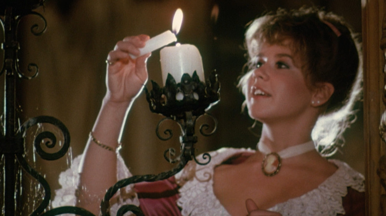 Marti Gaines lights candles