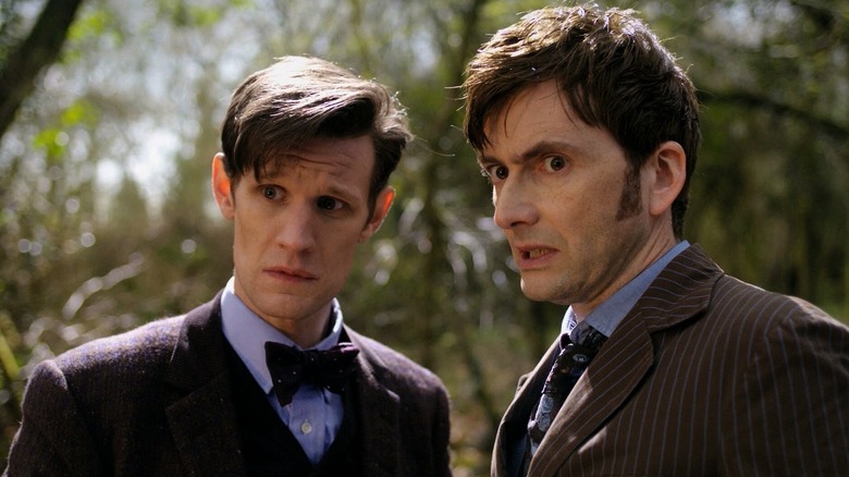 Matt Smith as The Doctor and David Tennant as The Doctor looking concerned (2013)