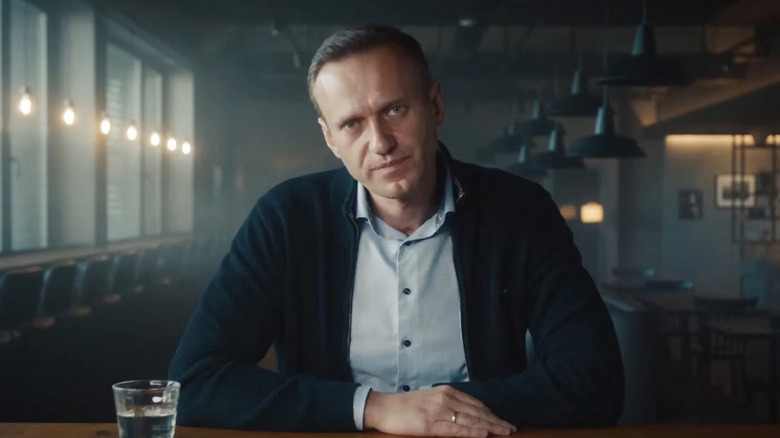 Alexei Navalny sits at table
