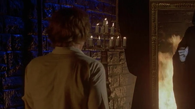 Skeleton looks at man