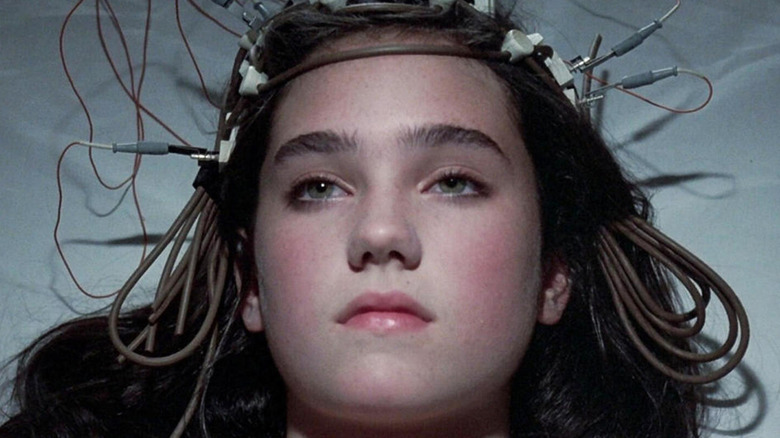Jennifer Connelly looks up with machine attached to head