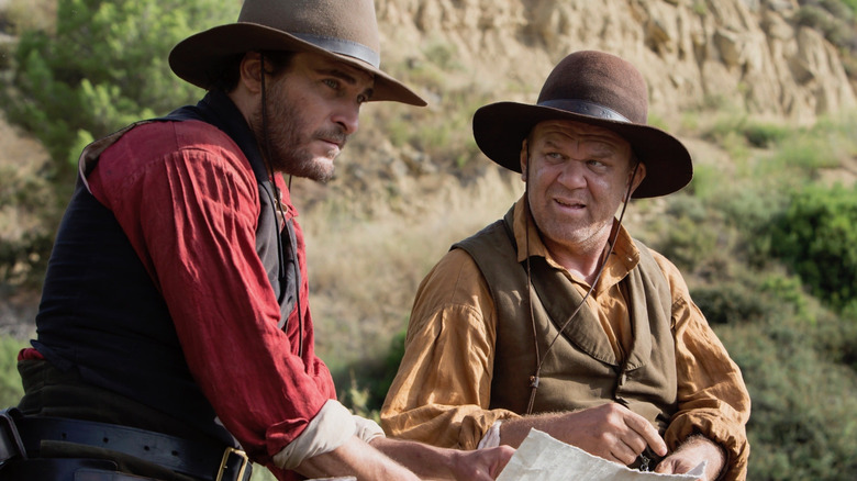 Joaquin Phoenix and John C. Reilly riding horses