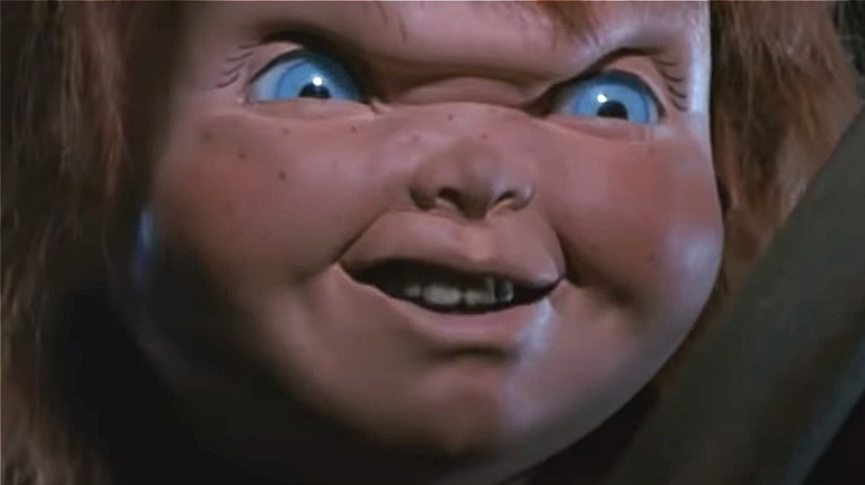 Chucky sneering