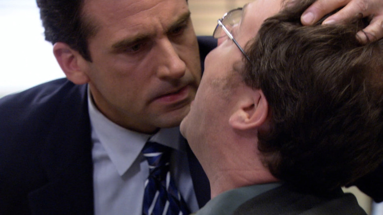 Michael Scott examines Dwight Schrute's teeth