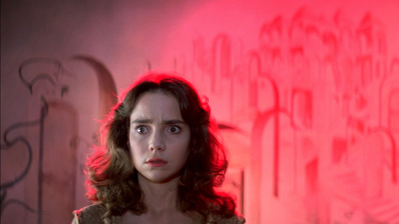 Scared woman in red light