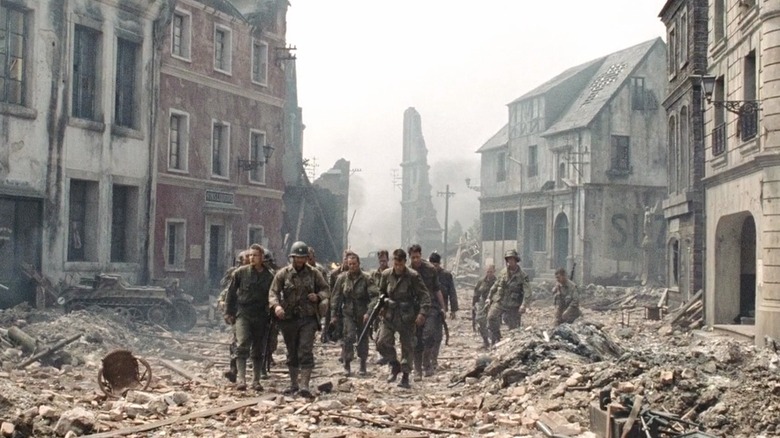 Captain Miller (Tom Hanks) and his team traveling through a decimated French town during their search for Private Ryan (Matt Damon)