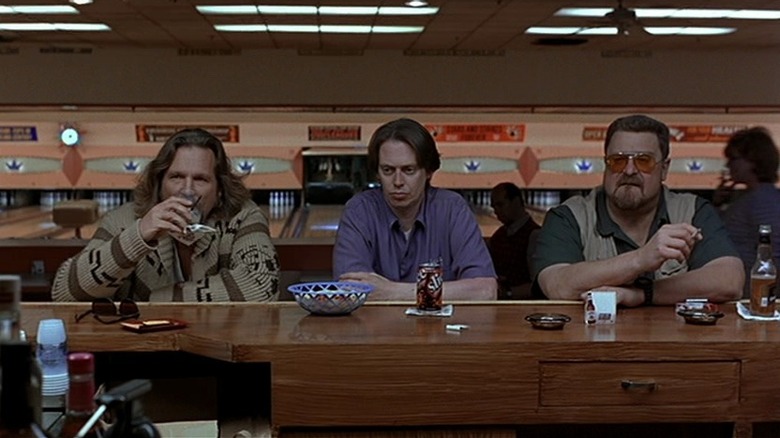 The Dude (Jeff Bridges) hanging out with his friends Donny (Steve Buscemi) and Walter (John Goodman) at a bowling alley