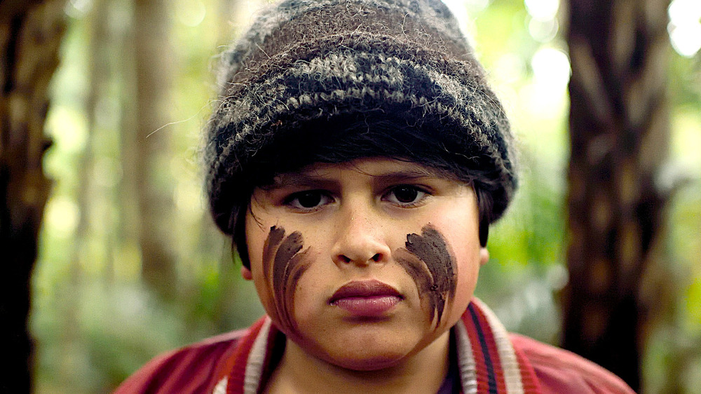Julian Dennison as Ricky determined with face paint