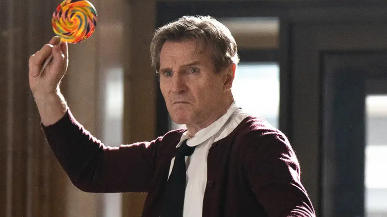 Frank Drebin Jr. brandishes a lollipop in "The Naked Gun" (2025)