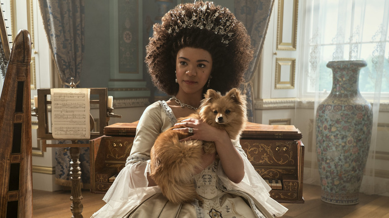 Young Queen Charlotte holding a dog