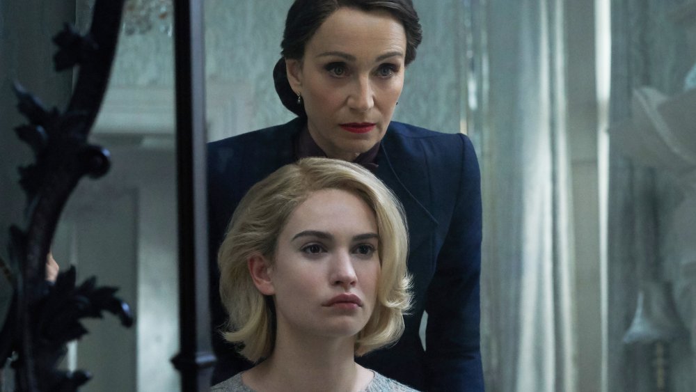 Lily James as Mrs. de Winter, Kristin Scott Thomas as Mrs. Danvers in Rebecca