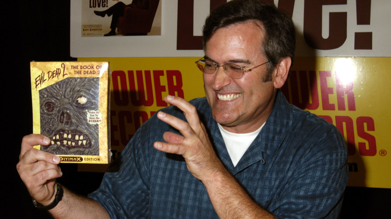Bruce Campbell with Evil Dead II DVD