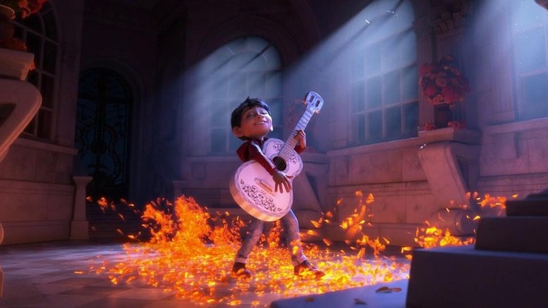 Coco plays guitar