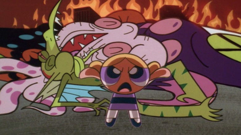 Bubbles stands in front of a pile of vanquished holographic monsters.