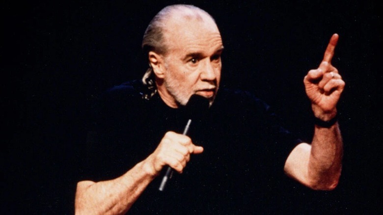 George Carlin performing on stage