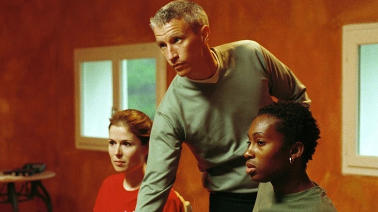 Anderson Cooper and contestants working in The Mole