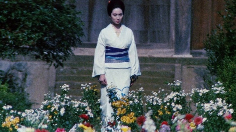 Lady Snowblood walks through flowers