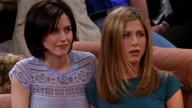 Monica and Rachel looking at Phoebe with unsure expressions