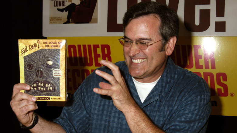 Bruce Campbell with Evil Dead 2 DVD