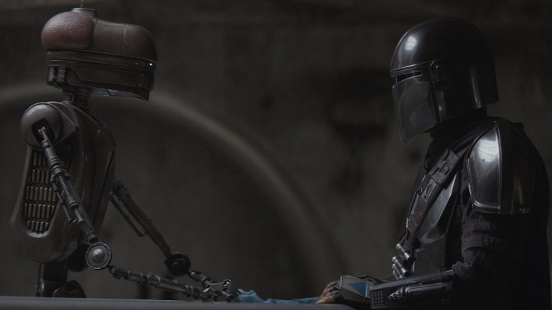 EV-9D9 speaking to Din Djarin