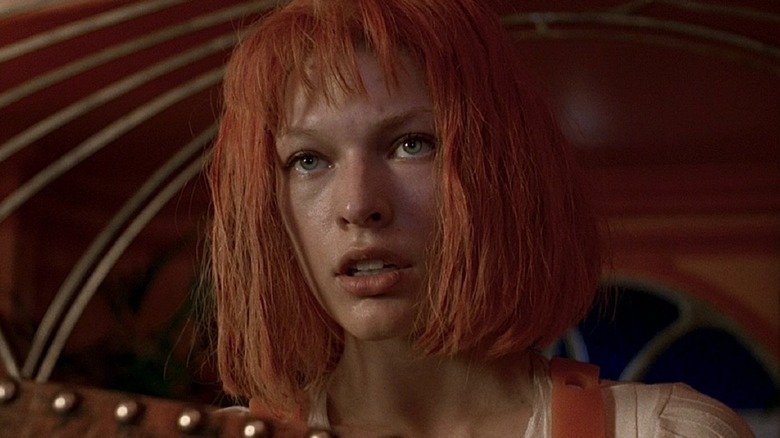 Girl with orange hair staring