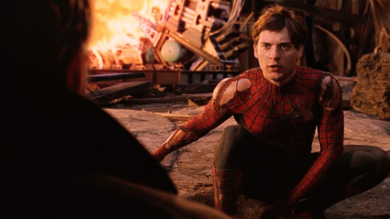 Spider-Man reasoning with a wounded Otto Octavius at the end of Spider-Man 2 (2004)