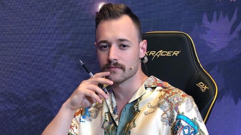 Rich posing in gaming chair