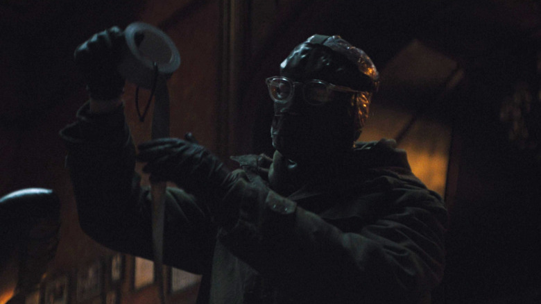 The Riddler holding duct tape