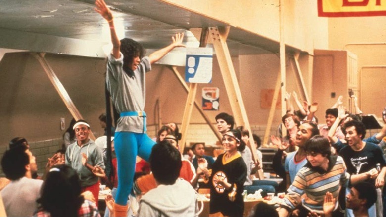 Student on table in cafeteria 