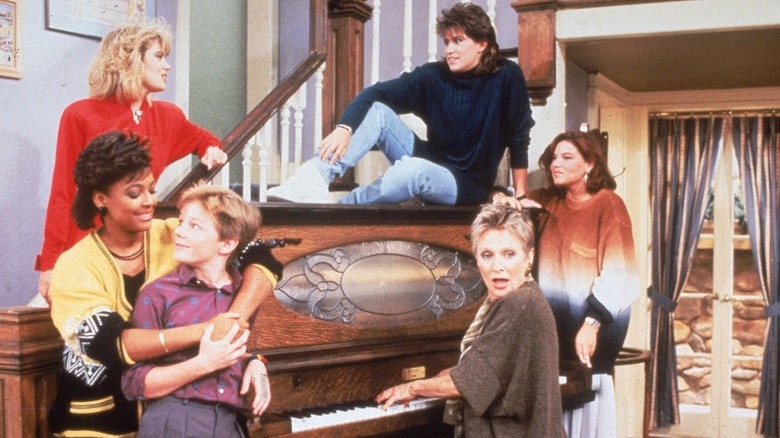 Facts of Life cast at piano