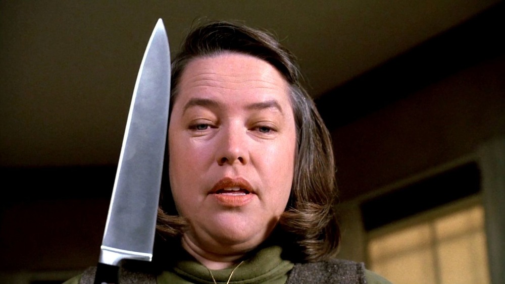 Kathy Bates brandishing a knife