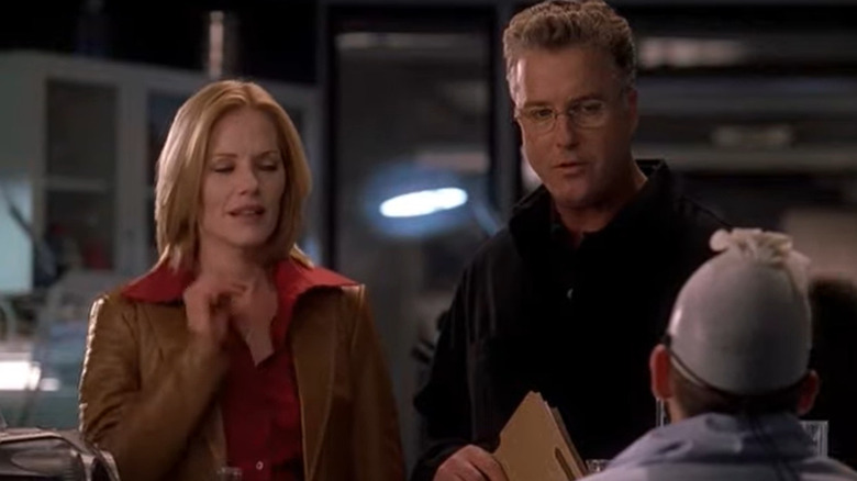 Gil Grissom and Catherine Willows talking to Greg Sanders