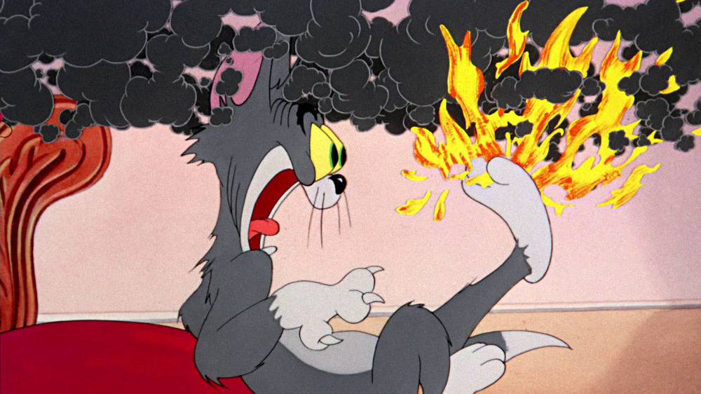Tom with foot on fire