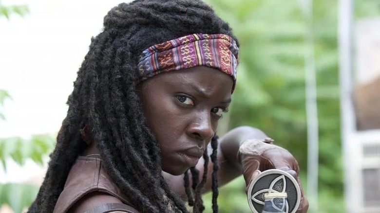 Michonne in the woods with walkers
