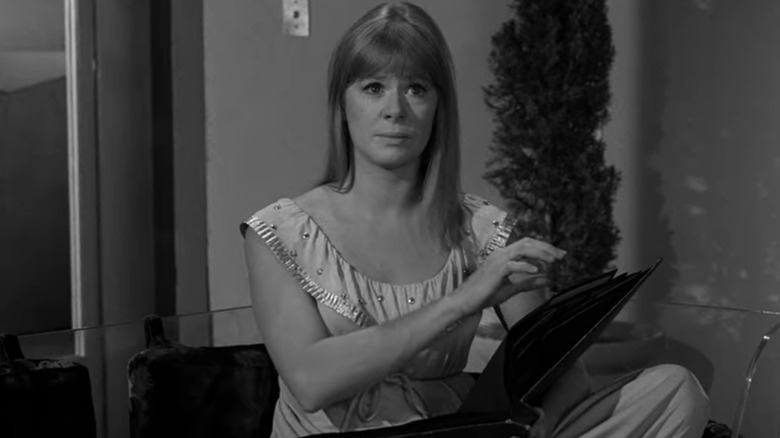 Marilyn Cuberle looks at book