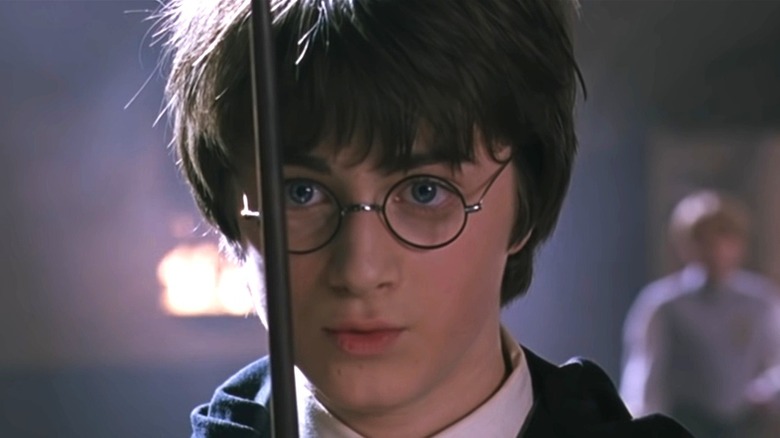Harry looking at his wand