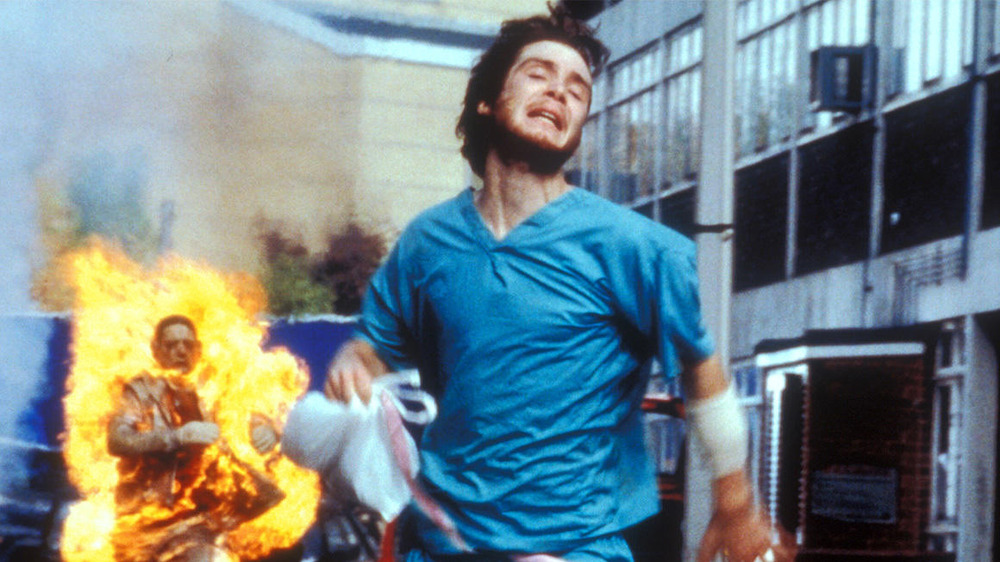 Jim running from a flaming Infected