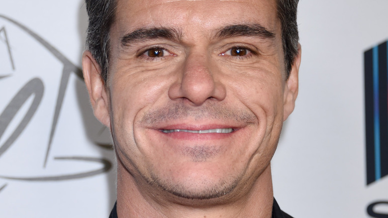 Tony Dalton smiles at an event