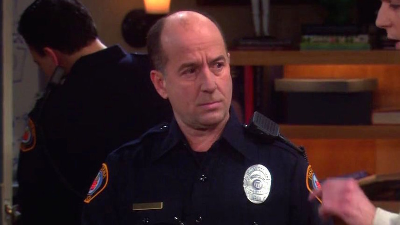 Officer Hackett takes a statement from Sheldon and Leonard on "The Big Bang Theory" (2007-2019)