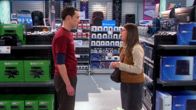 Sheldon and Amy shopping for a new game system