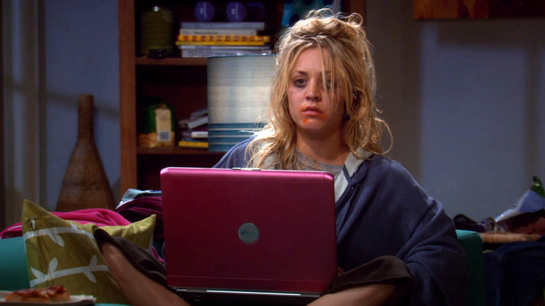 Penny looking insane and exhausted in front of her computer on The Big Bang Theory